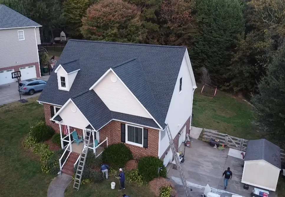 Full-spectrum roofing services showcasing a drone-assisted thermal roof inspection and a master-certified crew installing a 50-year sustainable shingle system.